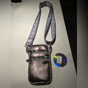 NWT top trenz iridescent cell phone cross body bag. Adjustable strap with stars!